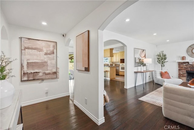 6028 Hart Ave, Temple City, CA 91780 - hallway featuring hardwood / wood-style floors, recessed lighting, arched walkways, and baseboards