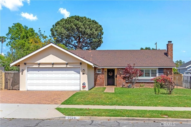 6028 Hart Ave, Temple City, CA 91780 - view of front facade featuring decorative driveway, an attached garage, brick siding, and a chimney