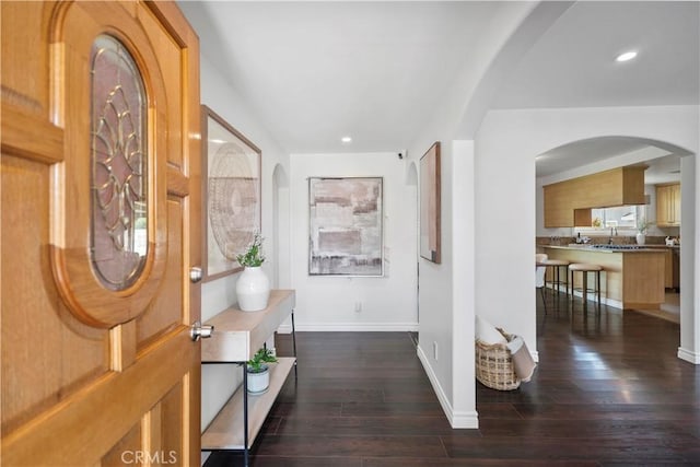 6028 Hart Ave, Temple City, CA 91780 - foyer entrance featuring dark wood-type flooring, baseboards, recessed lighting, and arched walkways