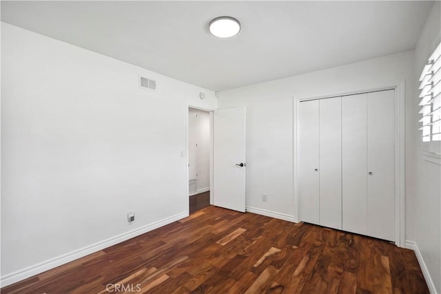 6028 Hart Ave, Temple City, CA 91780 - unfurnished bedroom with wood finished floors, a closet, and baseboards