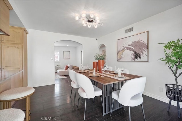 6028 Hart Ave, Temple City, CA 91780 - dining space with arched walkways, baseboards, and dark wood finished floors
