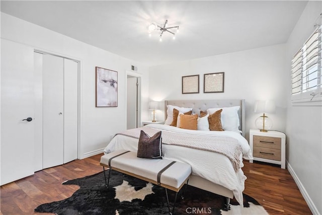 6028 Hart Ave, Temple City, CA 91780 - bedroom with wood finished floors, a closet, and baseboards