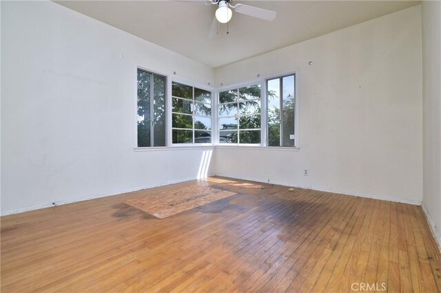 5625 Matilija Ave, Valley Glen, CA 91401 - unfurnished room featuring wood-type flooring, a ceiling fan, and baseboards