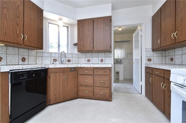 5625 Matilija Ave, Valley Glen, CA 91401 - kitchen with black dishwasher, range, a sink, decorative backsplash, and light floors