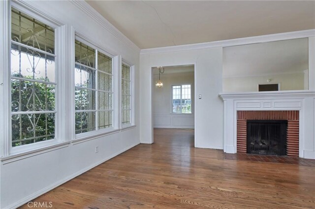 5625 Matilija Ave, Valley Glen, CA 91401 - unfurnished living room with wood finished floors, a fireplace, ornamental molding, and baseboards