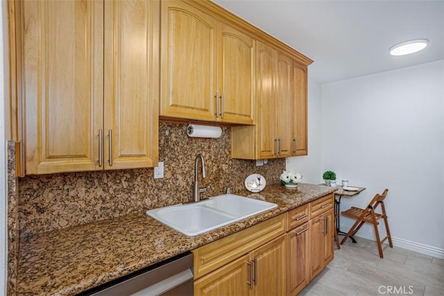 1115 S Elm Dr Unit 510, Los Angeles, CA 90035 - kitchen with a sink, decorative backsplash, dark stone countertops, and baseboards