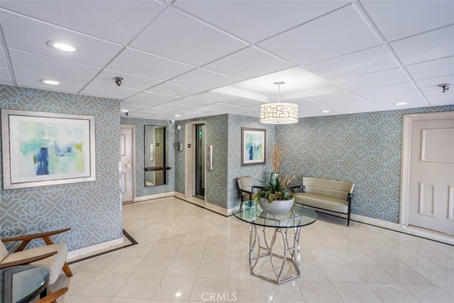 1115 S Elm Dr Unit 510, Los Angeles, CA 90035 - building lobby with wallpapered walls, a paneled ceiling, and recessed lighting
