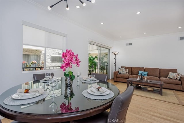 1115 S Elm Dr Unit 510, Los Angeles, CA 90035 - dining area featuring crown molding, light wood-style floors, recessed lighting, and a chandelier
