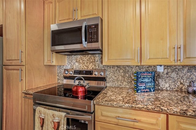 1115 S Elm Dr Unit 510, Los Angeles, CA 90035 - kitchen featuring stainless steel appliances, backsplash, light stone counters, and light brown cabinets