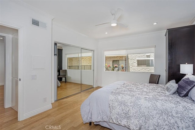 1115 S Elm Dr Unit 510, Los Angeles, CA 90035 - bedroom with ornamental molding, light wood-type flooring, baseboards, a closet, and a ceiling fan