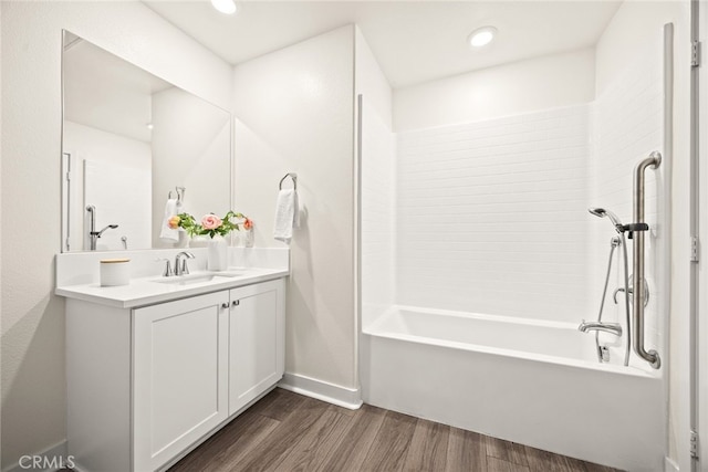 2639 Glamis Ct, Arcadia, CA 91007 - bathroom featuring wood finished floors, vanity, baseboards, washtub / shower combination, and recessed lighting