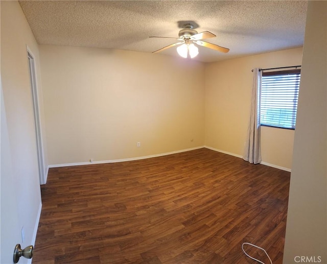 2120 Jacaranda Ct, San Bernardino, CA 92404 - spare room featuring dark wood-style floors, a ceiling fan, a textured ceiling, and baseboards