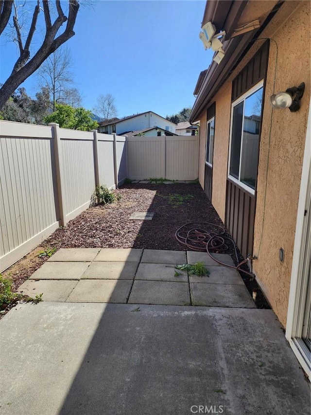 2120 Jacaranda Ct, San Bernardino, CA 92404 - fenced backyard with a patio