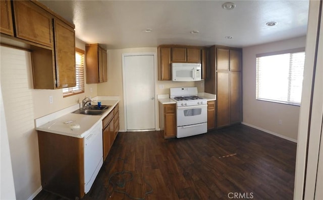 2120 Jacaranda Ct, San Bernardino, CA 92404 - kitchen with white appliances, a sink, dark wood-style flooring, brown cabinets, and light countertops