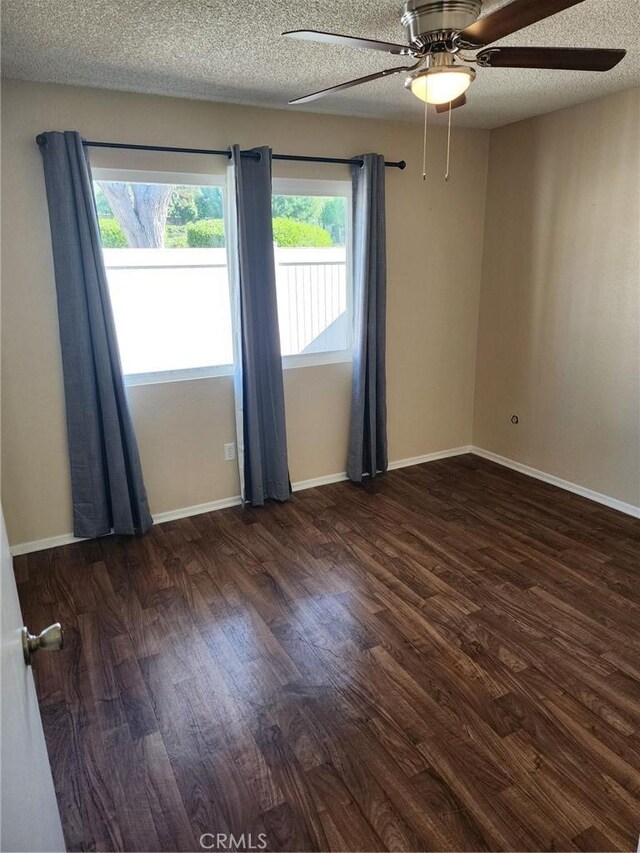 2120 Jacaranda Ct, San Bernardino, CA 92404 - unfurnished room with wood finished floors, a ceiling fan, a textured ceiling, and baseboards