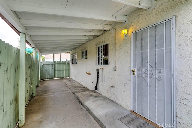 view of patio / terrace featuring fence and a gate