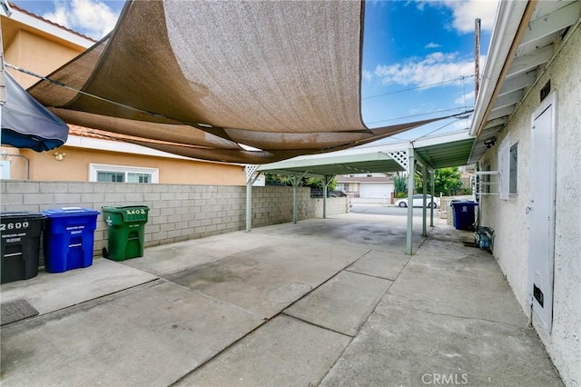 view of patio featuring fence