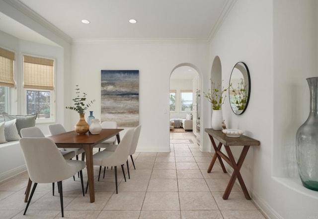 1002 Alexandra Ln, Encinitas, CA 92024 - dining space featuring crown molding, light tile patterned floors, arched walkways, baseboards, and recessed lighting