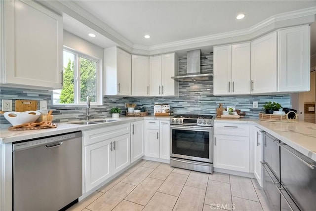 4273 Spoon Bill Way, Oceanside, CA 92057 - kitchen with appliances with stainless steel finishes, wall chimney exhaust hood, a sink, white cabinetry, and decorative backsplash