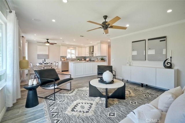 4273 Spoon Bill Way, Oceanside, CA 92057 - living area featuring ceiling fan, ornamental molding, light wood finished floors, recessed lighting, and baseboards