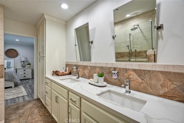 4273 Spoon Bill Way, Oceanside, CA 92057 - bathroom featuring a shower stall, double vanity, backsplash, a textured wall, and ensuite bathroom