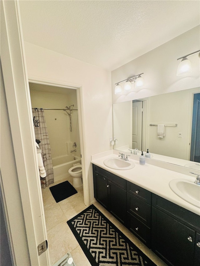 4772 Marrieta St, Jurupa Valley, CA 91752 - bathroom with toilet, double vanity, tile patterned flooring, and a textured ceiling