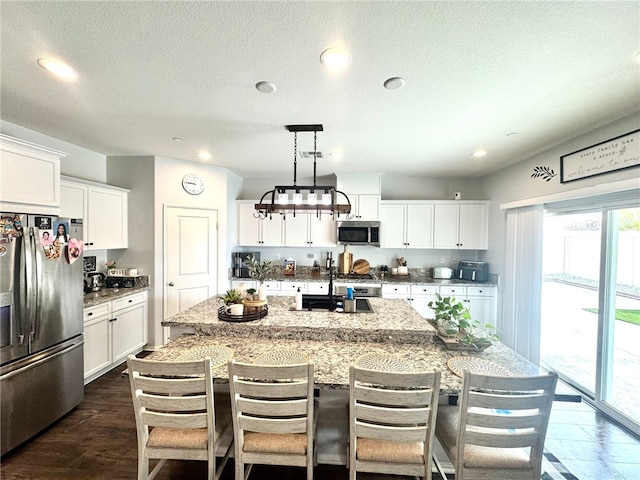 4772 Marrieta St, Jurupa Valley, CA 91752 - kitchen featuring appliances with stainless steel finishes, healthy amount of natural light, a spacious island, a kitchen breakfast bar, and recessed lighting