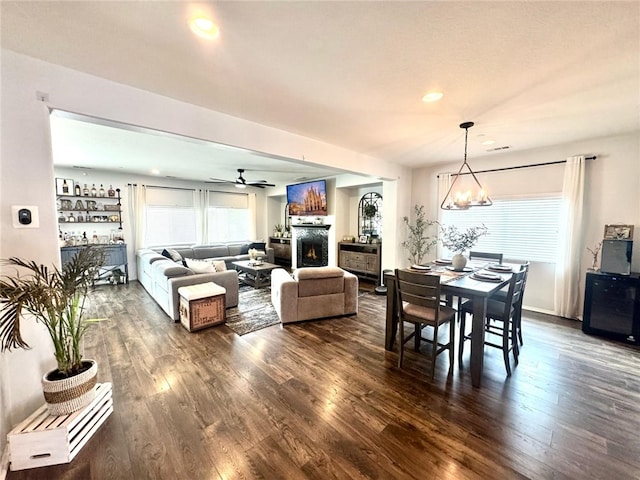 4772 Marrieta St, Jurupa Valley, CA 91752 - dining space with dark wood-type flooring, a warm lit fireplace, a ceiling fan, and recessed lighting