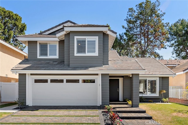 11 Bayside, Irvine, CA 92614 - view of front of home with decorative driveway, a garage, and a tiled roof