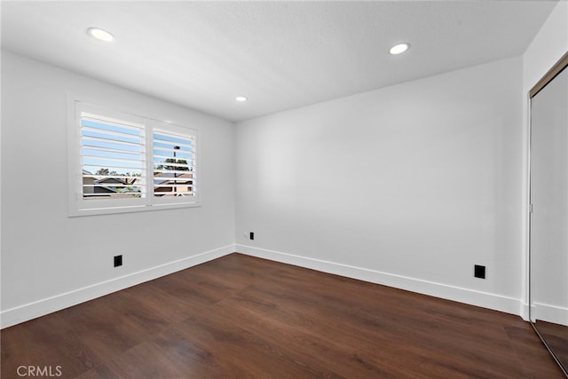 11 Bayside, Irvine, CA 92614 - unfurnished room with baseboards, dark wood-style flooring, and recessed lighting