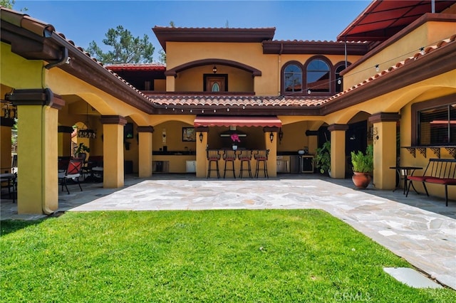 948 Peninsula Ave, Claremont, CA 91711 - rear view of property with a patio, stucco siding, a lawn, and a tiled roof