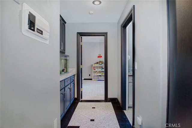 948 Peninsula Ave, Claremont, CA 91711 - hallway with baseboards, granite floors, and inlaid floor details