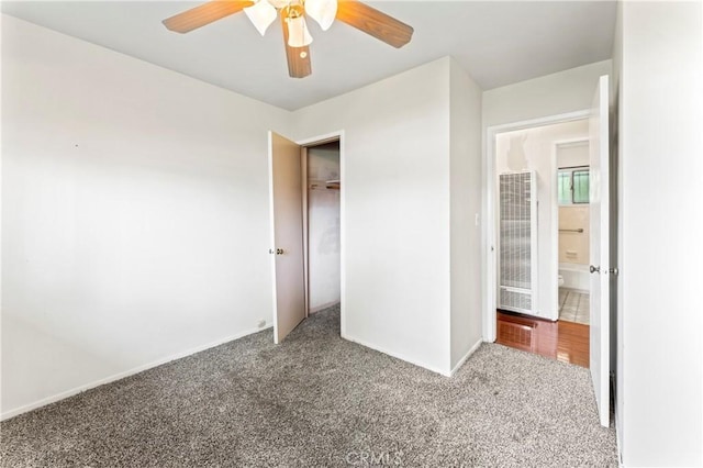 4303 Kansas Ave, Riverside, CA 92507 - unfurnished bedroom with a heating unit, carpet floors, a closet, baseboards, and a ceiling fan