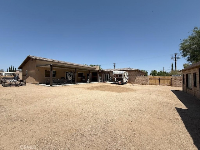17857 Main St, Hesperia, CA 92345 - back of property with stucco siding and a patio area