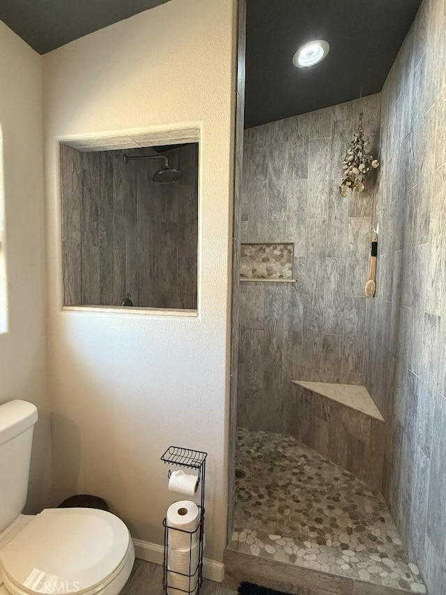 17857 Main St, Hesperia, CA 92345 - bathroom featuring toilet, walk in shower, and baseboards