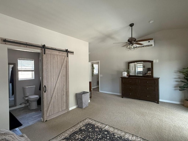 17857 Main St, Hesperia, CA 92345 - unfurnished bedroom featuring a barn door, carpet flooring, baseboards, lofted ceiling, and a ceiling fan