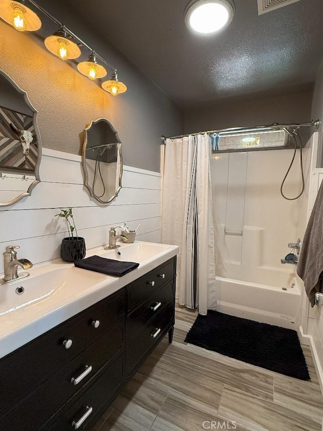 17857 Main St, Hesperia, CA 92345 - bathroom with shower / bath combination with curtain, double vanity, and wainscoting