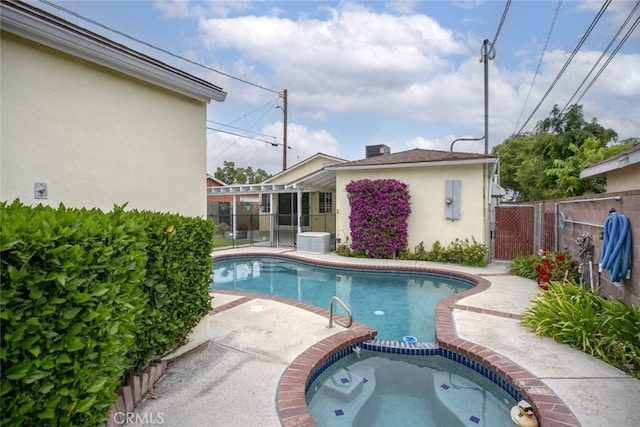835 N Lincoln St, Burbank, CA 91506 - view of pool featuring fence, a patio area, a pool with connected hot tub, and a gate