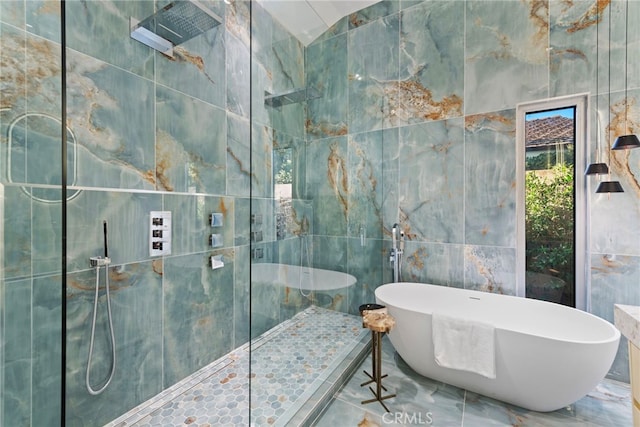 1318 Outrigger Dr, Corona Del Mar, CA 92625 - full bathroom with tile walls, walk in shower, a freestanding tub, and marble tiled floors
