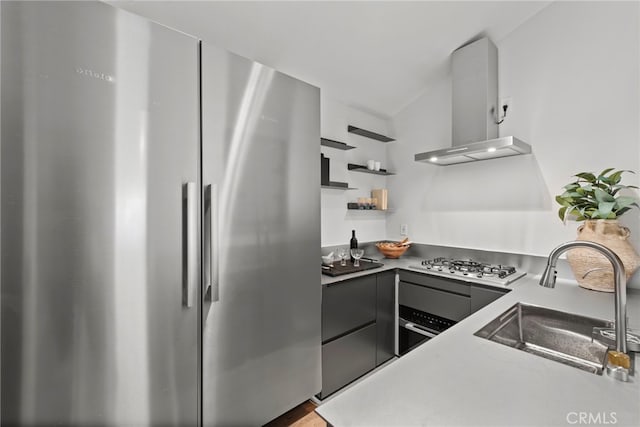 1318 Outrigger Dr, Corona Del Mar, CA 92625 - kitchen featuring stainless steel appliances, wall chimney range hood, a sink, open shelves, and gray cabinetry