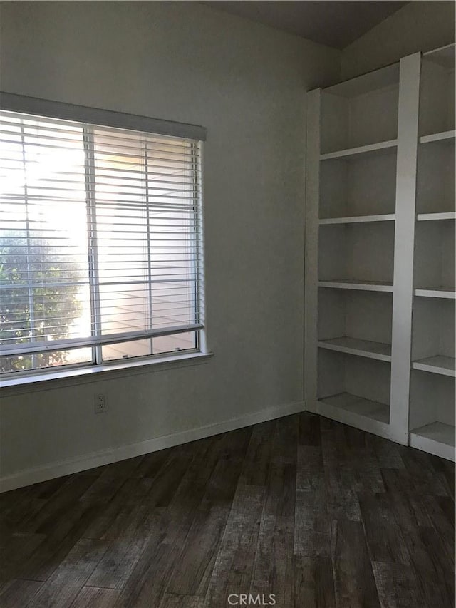 26021 Crestmont Cir, Menifee, CA 92586 - empty room featuring dark wood-style flooring and baseboards