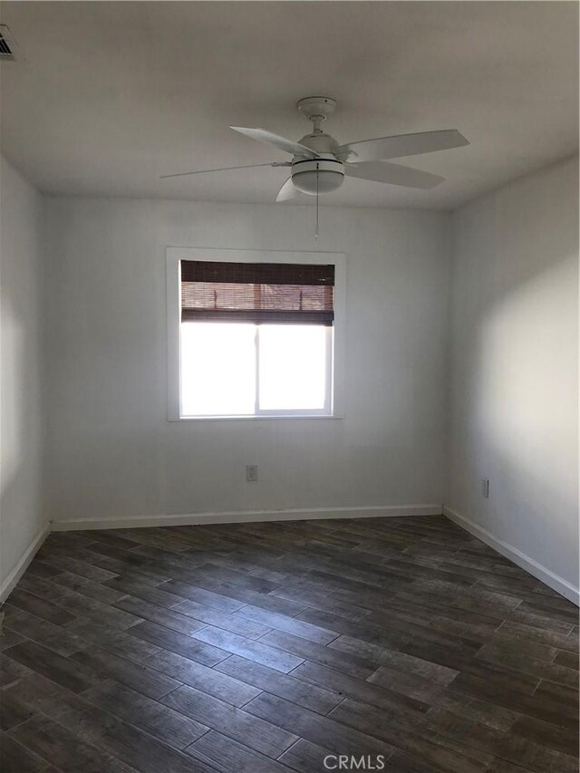 26021 Crestmont Cir, Menifee, CA 92586 - unfurnished room with a ceiling fan, dark wood-style flooring, and baseboards