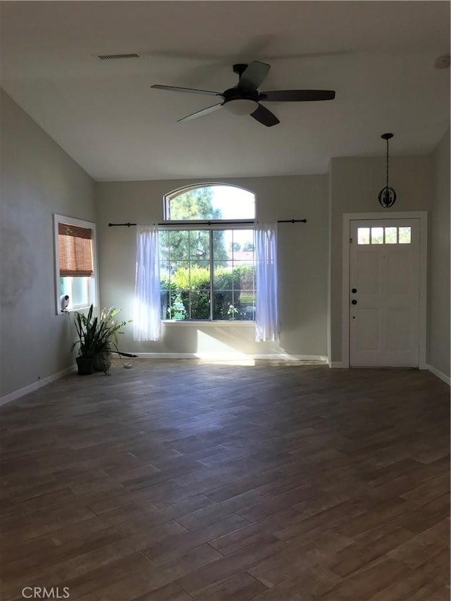 26021 Crestmont Cir, Menifee, CA 92586 - unfurnished living room featuring vaulted ceiling, baseboards, a ceiling fan, and wood finished floors