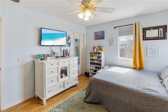 7311 Pinewood Ct, Eastvale, CA 92880 - bedroom with light wood-style flooring and a ceiling fan