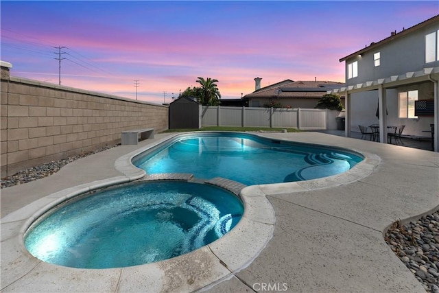 7311 Pinewood Ct, Eastvale, CA 92880 - view of pool featuring a pool with connected hot tub, a fenced backyard, and a patio area