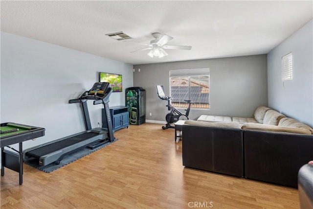 7311 Pinewood Ct, Eastvale, CA 92880 - exercise area featuring a ceiling fan, light wood finished floors, and baseboards