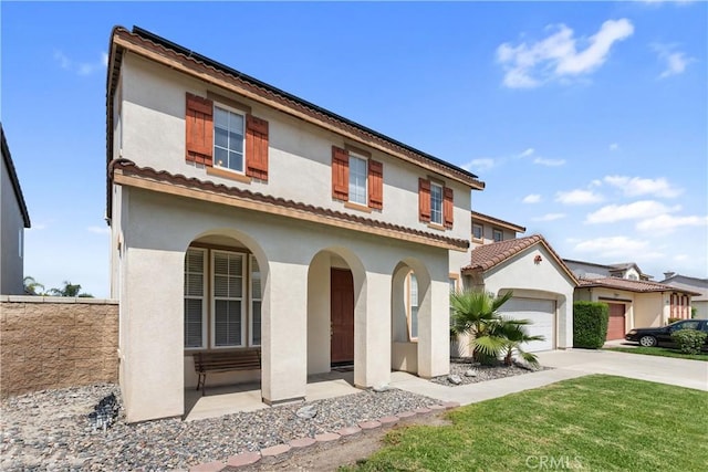 7311 Pinewood Ct, Eastvale, CA 92880 - mediterranean / spanish-style house with concrete driveway, stucco siding, and a garage