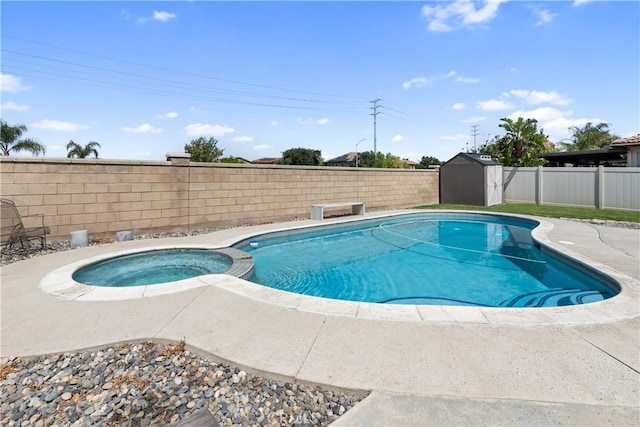 7311 Pinewood Ct, Eastvale, CA 92880 - view of pool featuring a fenced backyard, a patio, and a pool with connected hot tub