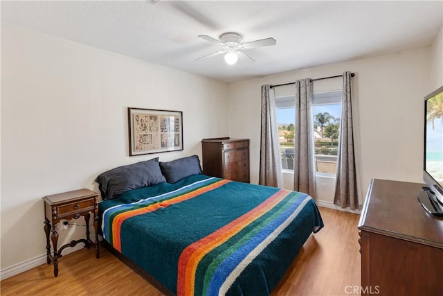 7311 Pinewood Ct, Eastvale, CA 92880 - bedroom featuring light wood-type flooring, baseboards, and a ceiling fan