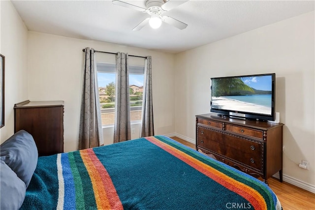 7311 Pinewood Ct, Eastvale, CA 92880 - bedroom with wood finished floors, baseboards, and ceiling fan